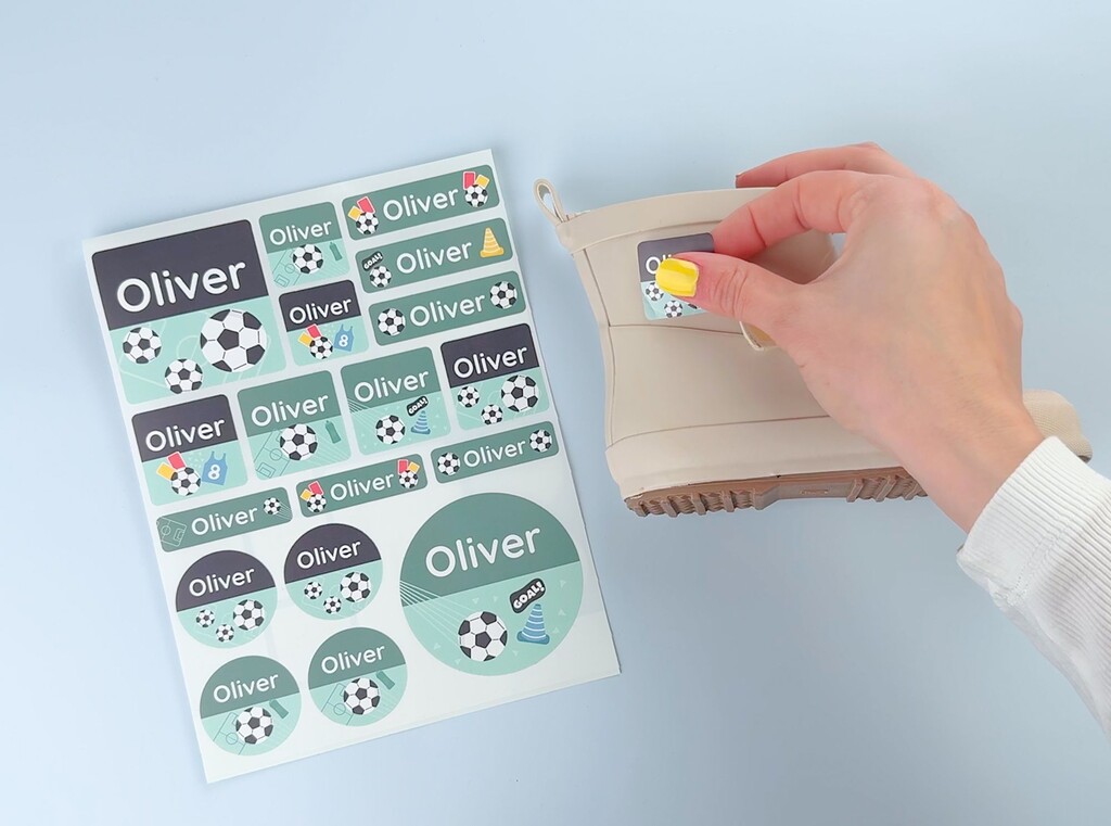 A set of personalised large labels with the name oliver and a football theme