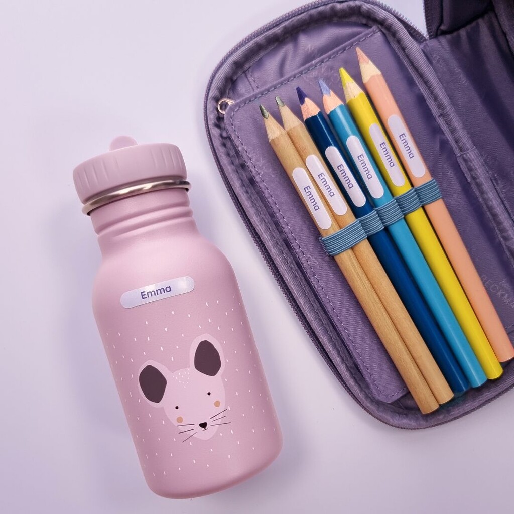 How to keep your child’s backpack organised 1 Pink water bottle with a mouse design and a pencil case, both labeled with personalized namelabels
