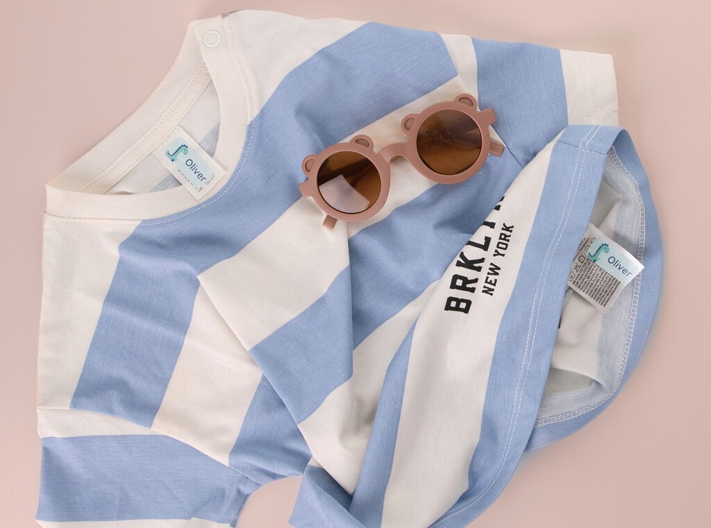 A striped shirt and sun glasses for daycare labeled with personalised stick on-labels