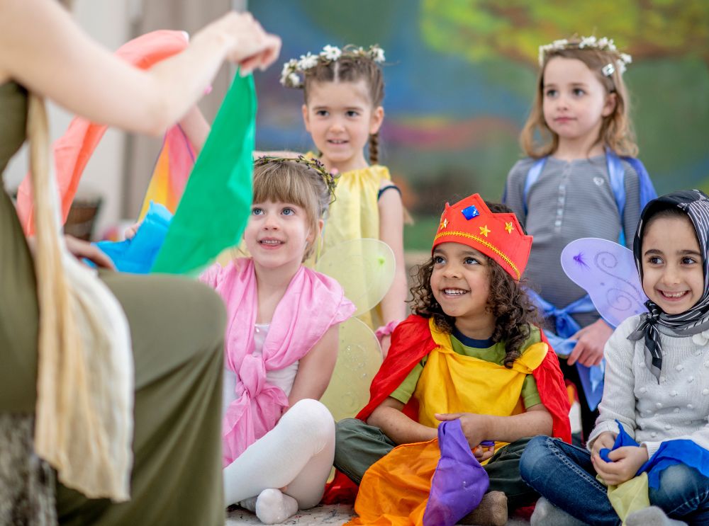 Kids in playful pirate and animal fancy dress enjoying a birthday celebration.