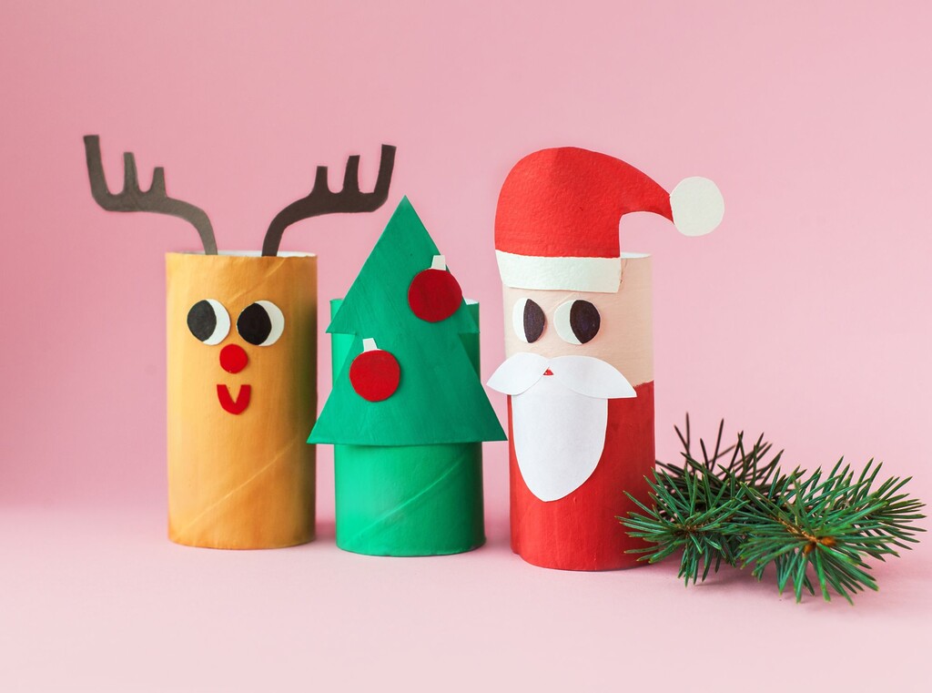 Easy Christmas crafts for kids using toilet paper rolls, decorated as a reindeer, a Christmas tree and Santa.
