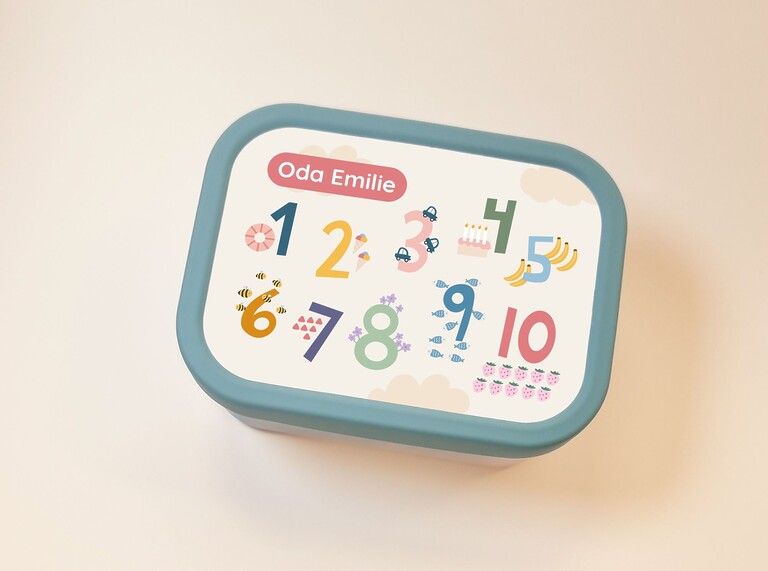 large green lunchbox with name and numbers
