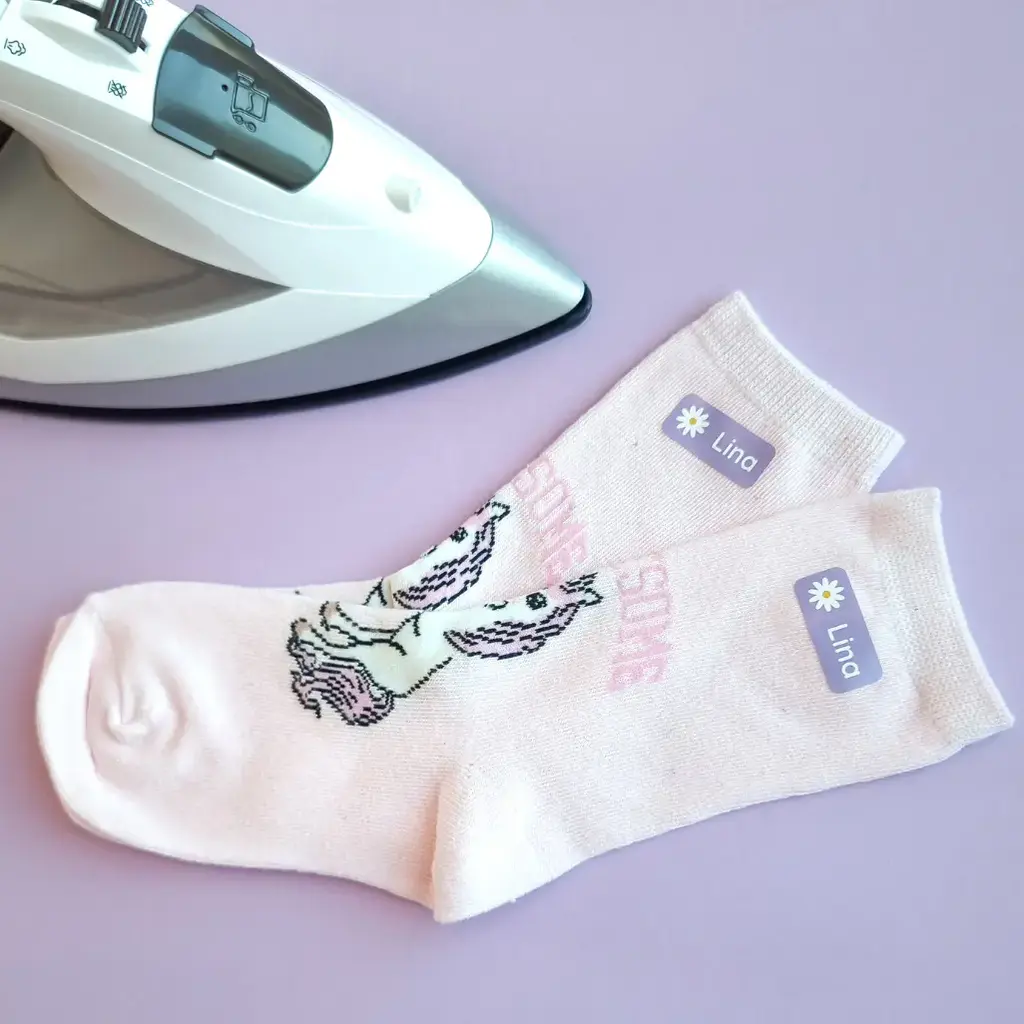 How to apply iron-on labels: a simple guide for long-lasting results 1 Personalised iron-on name labels on socks.