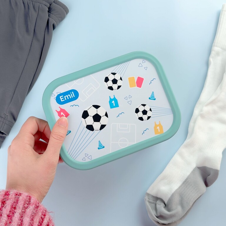 green football lunchbox and hand