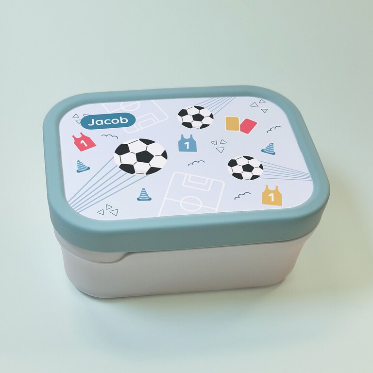 green lunchbox with football design