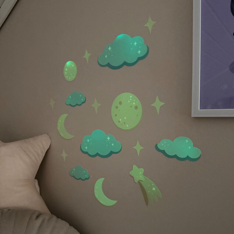 glow-in-the-dark wall stickers with night sky motif in a kids' room in the dark