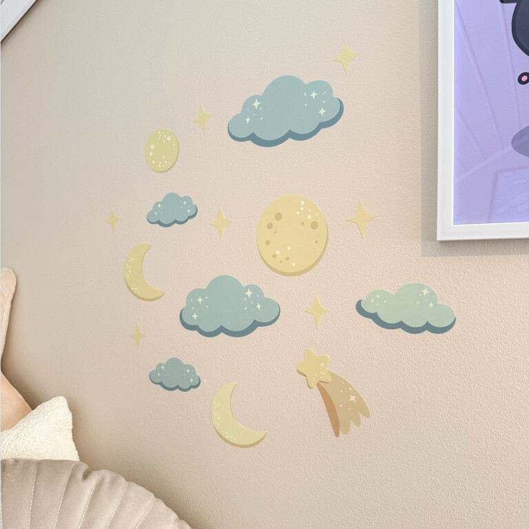 glow-in-the-dark wall stickers with night sky placed on a kids' room wall