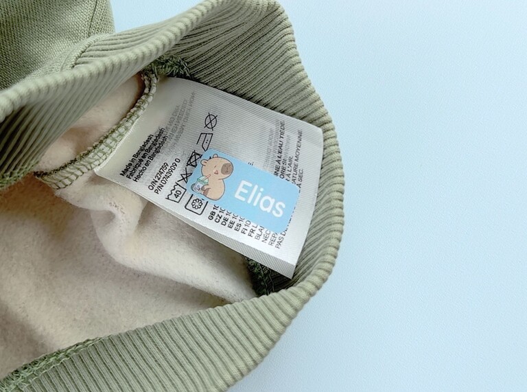 Sticker attached to a wash label on a kids' garment