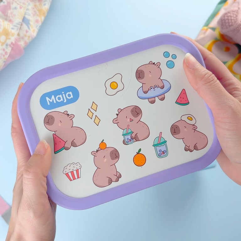 Purple lunchbox with name and capybara design