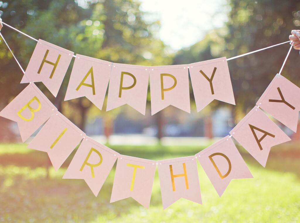 Easy and creative kids’ birthday party ideas 2 Happy birthday bunting hanging outdoors in a garden
