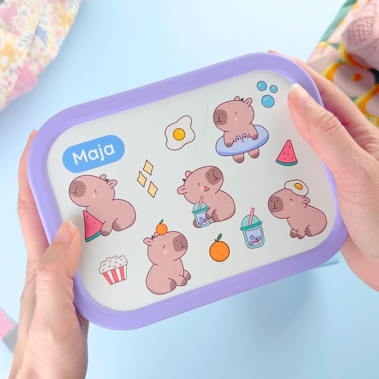 Personalised lunch box with capybara design and the name Maja